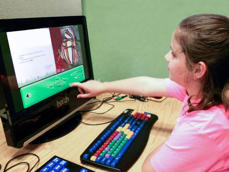 Disabled child on assistive technology
